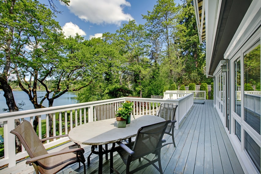 Lake view wood deck with white railings