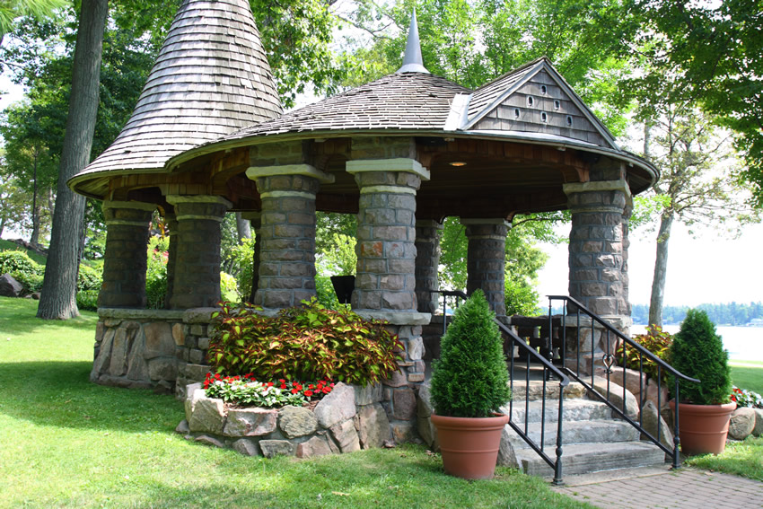 Lakeside rock gazebo with wood shingles