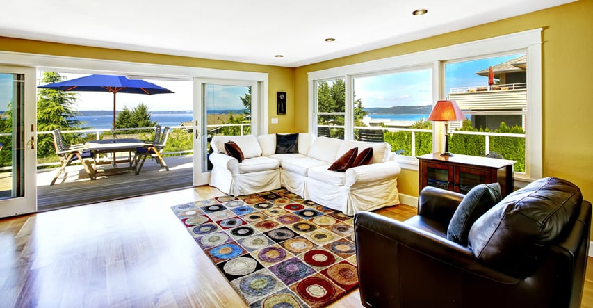 Living room with bay views and large wraparound deck