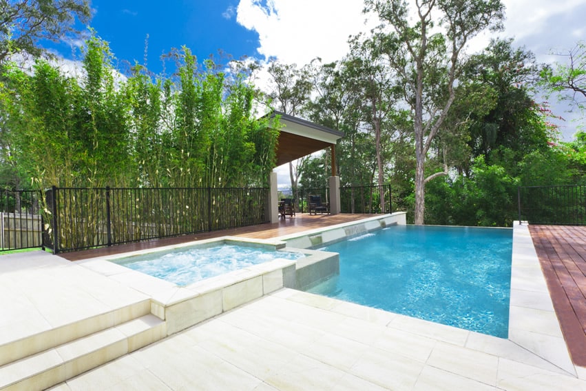 Luxury infinity pool with hot tub and cabana