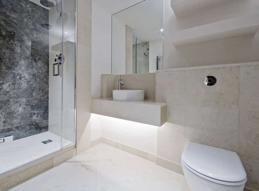 Modern bathroom design is spacious with natural limestone tiles
