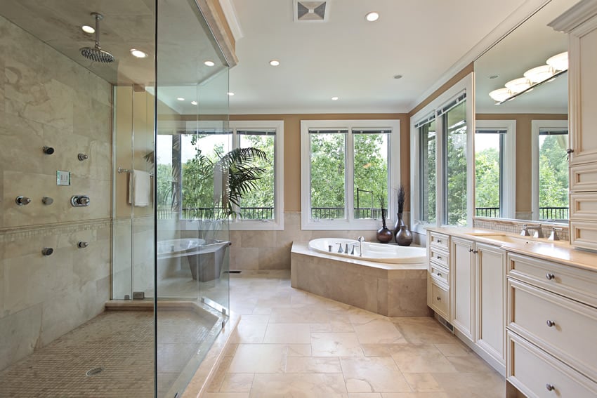 Bathroom with grooved shower tiles, sliding windows and alcove tub