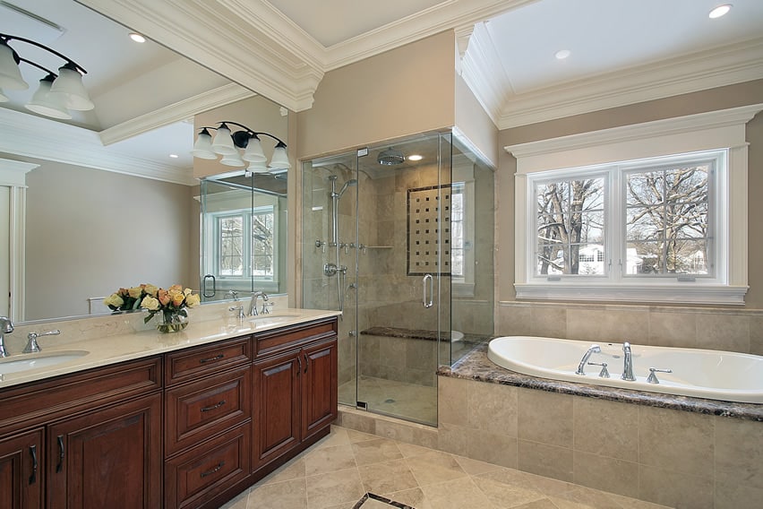 Elegant master bathroom with high quality polished natural stone tiles, combined with a nice warm beige paint