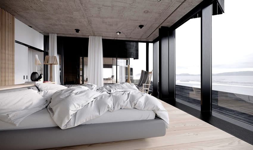 Bedroom with wood ceiling, walls with wood slats and windows