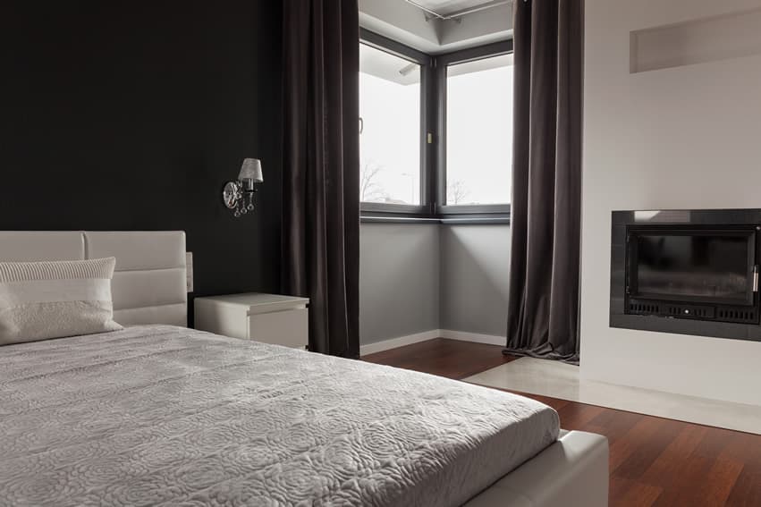 Modern bedroom dark curtains white bed