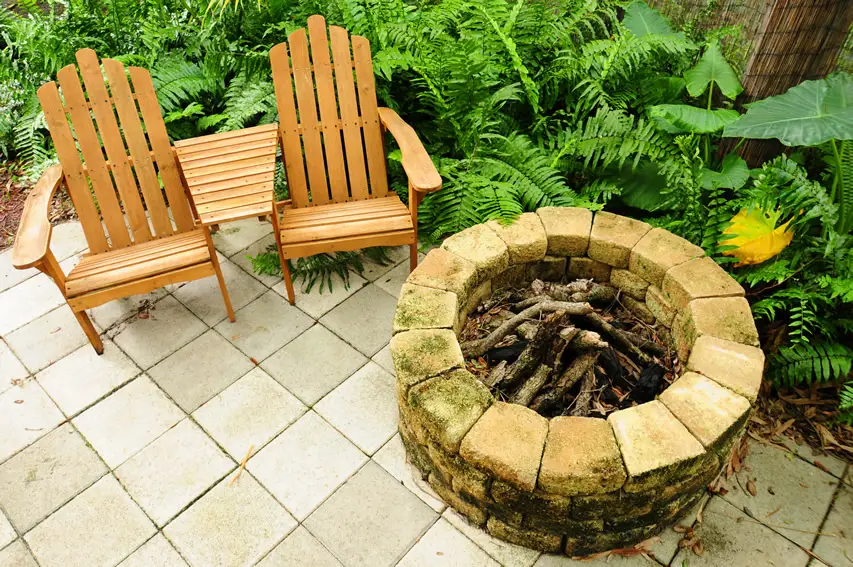 Outdoor fire pit with adirondack chairs