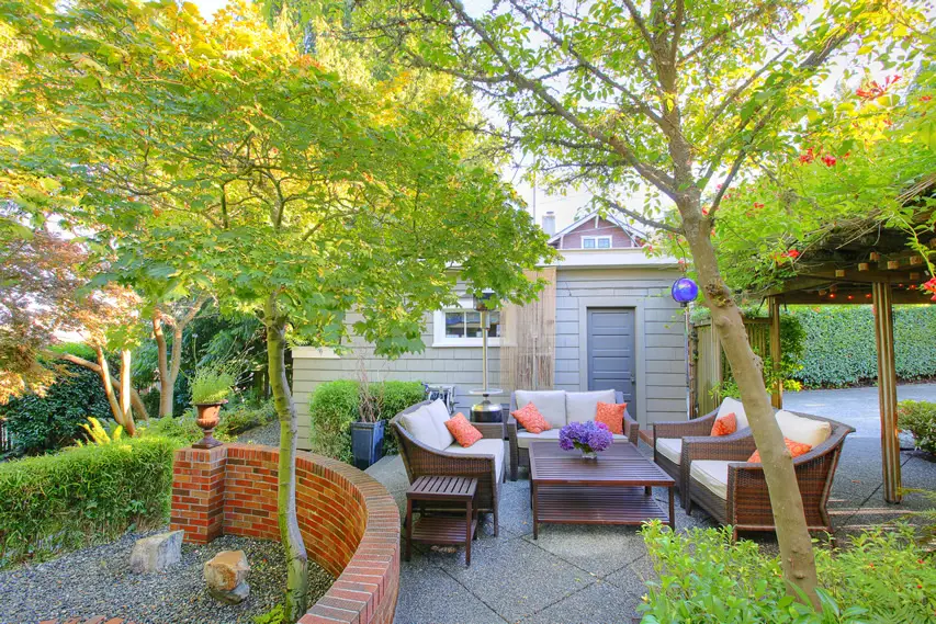 Patio with terrazzo flooring and pergola with climbing vine flowers