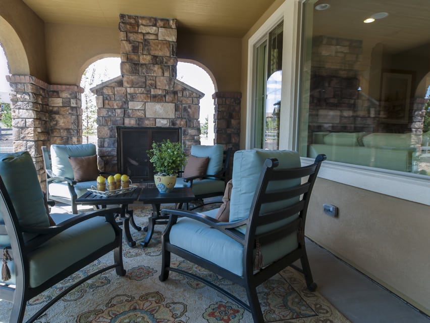 Patio with polished concrete floors and stone fireplace