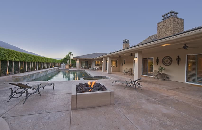 Swimming pool patio with outdoor fire pit