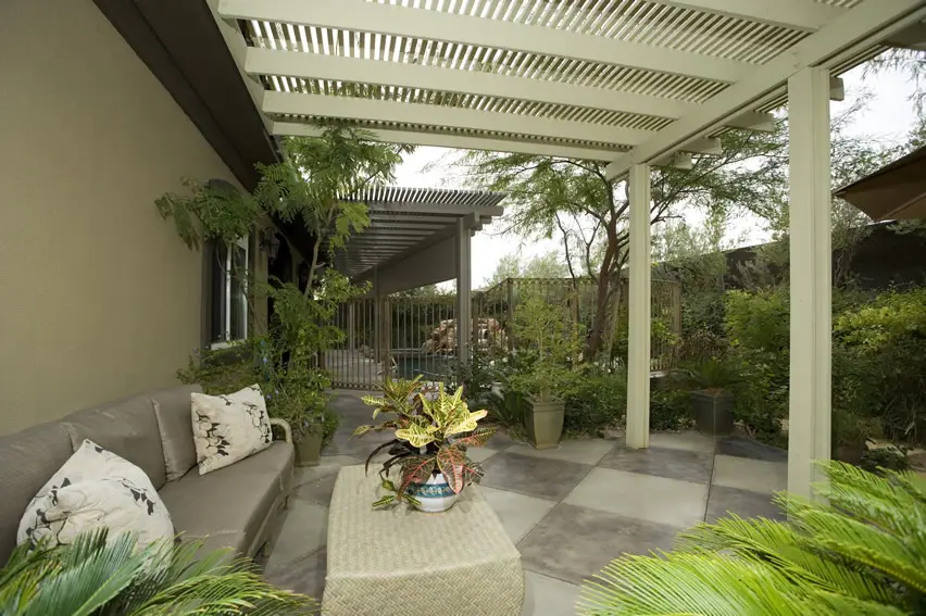 Patio with white pergola and outdoor furniture