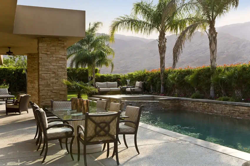 Patio with outdoor dining space and different types of seating