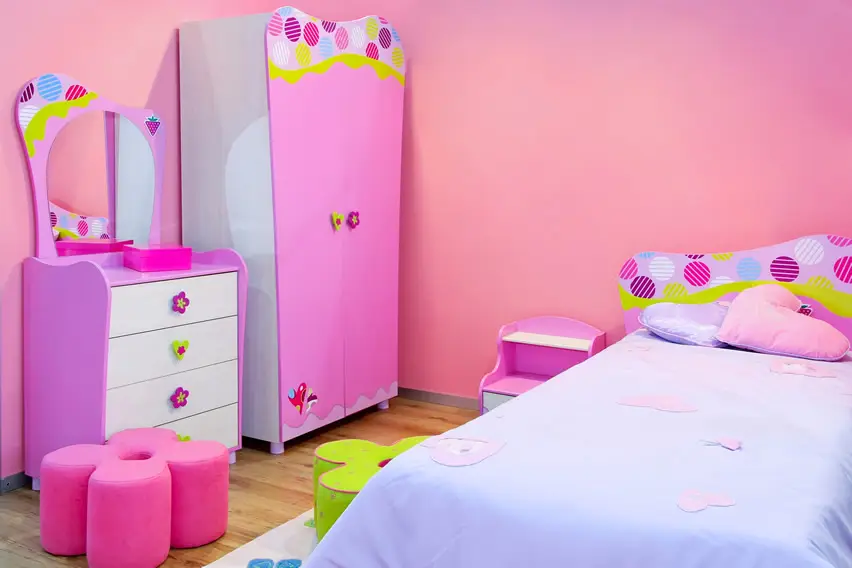 Cheerful girl's bedroom with flowers and polka dots