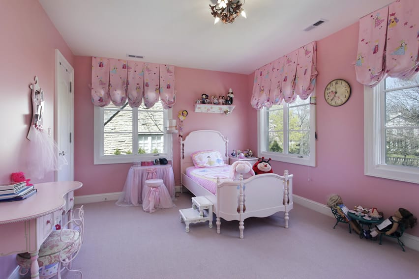 Soft pink hued bedroom with pink patterned valances