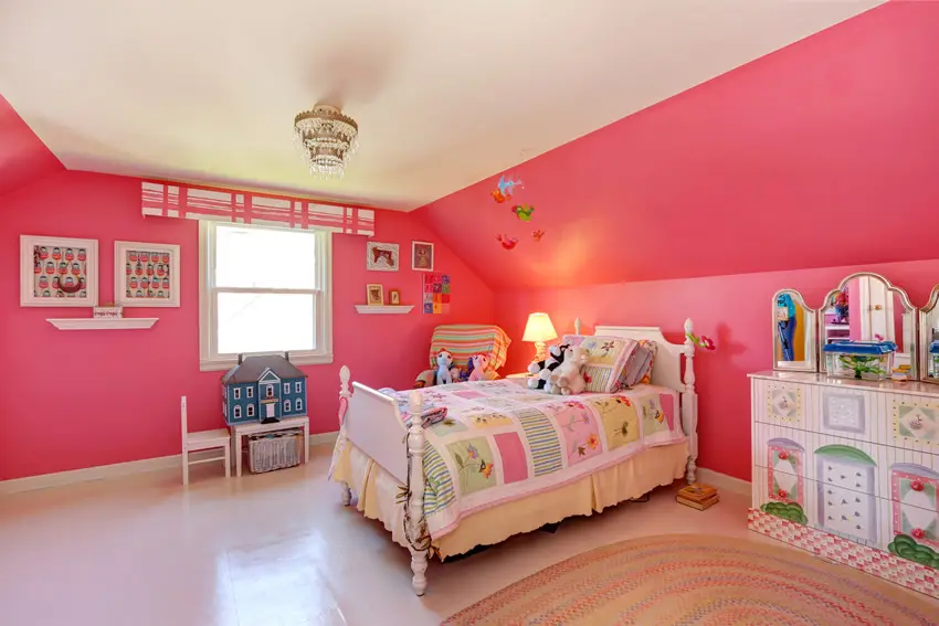 Pink girl's bedroom with white vaulted ceiling and small tiered chandelier 