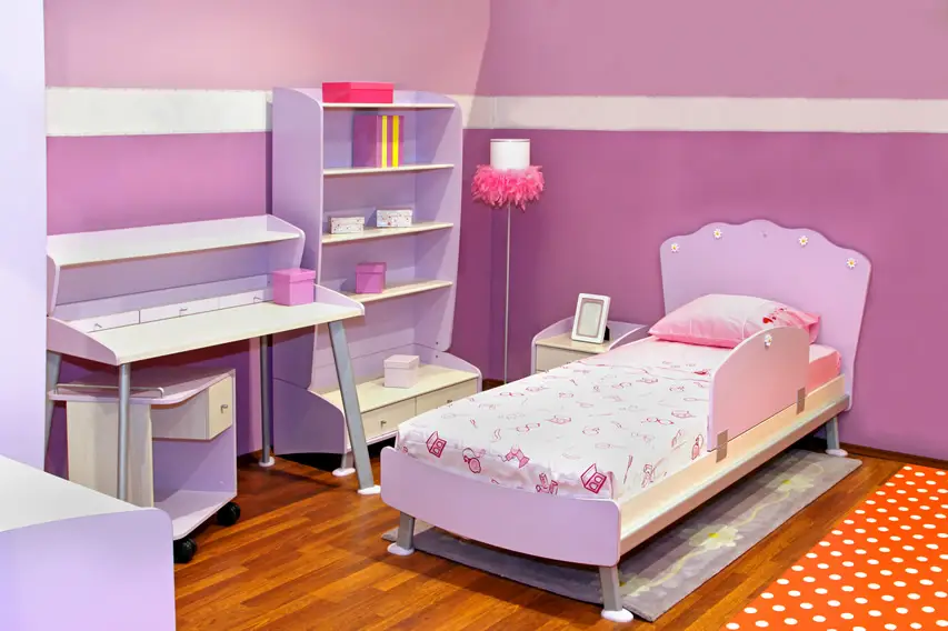 Girl's bedroom with purple theme and furniture