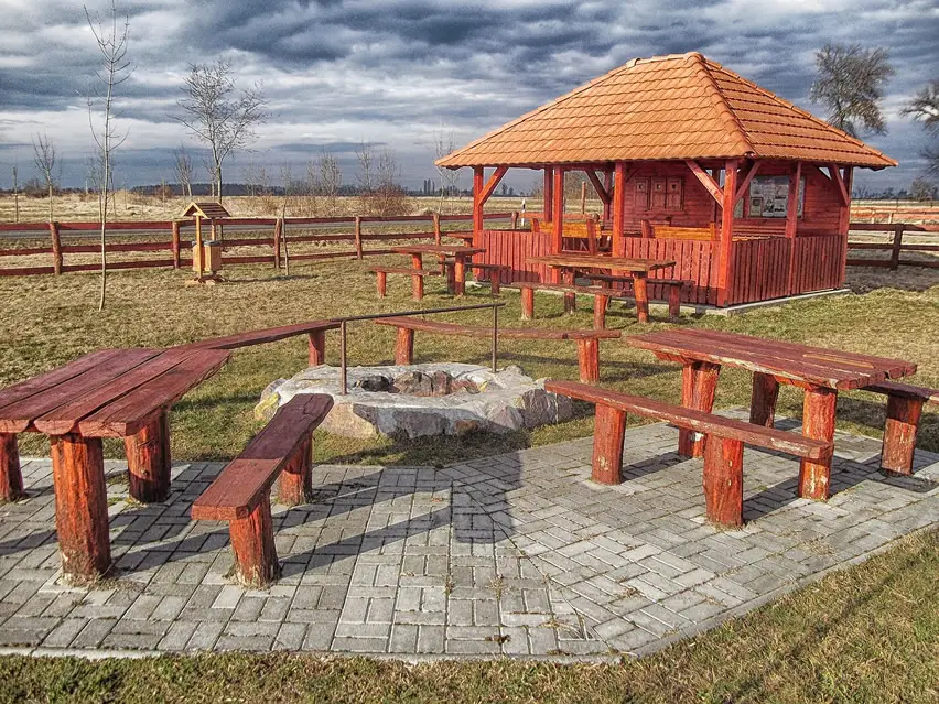 Rock fire pit with wood benches