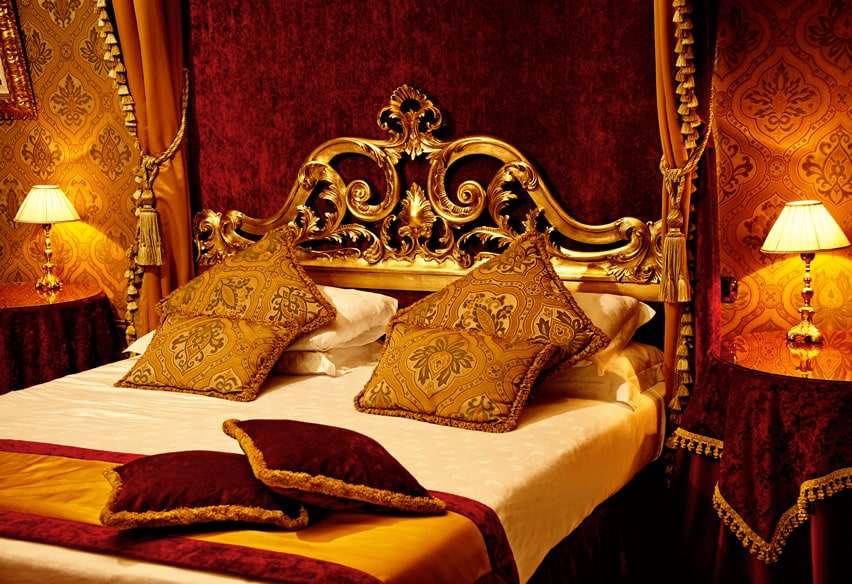 Royal bedroom with gold decor