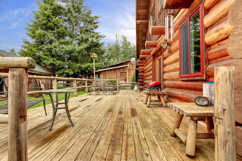 Rustic deck at log cabin backyard