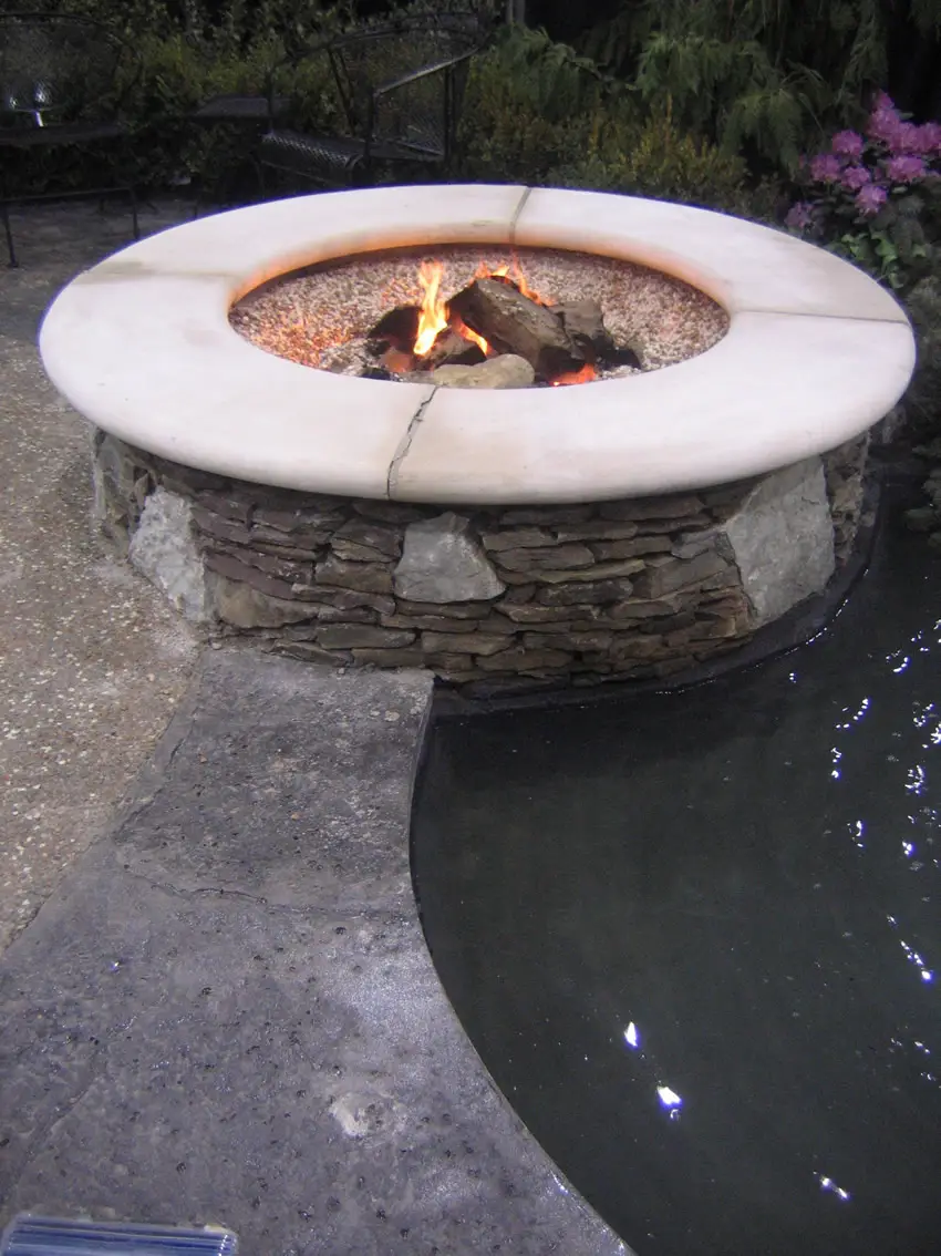 Slate fire pit overlooking pool