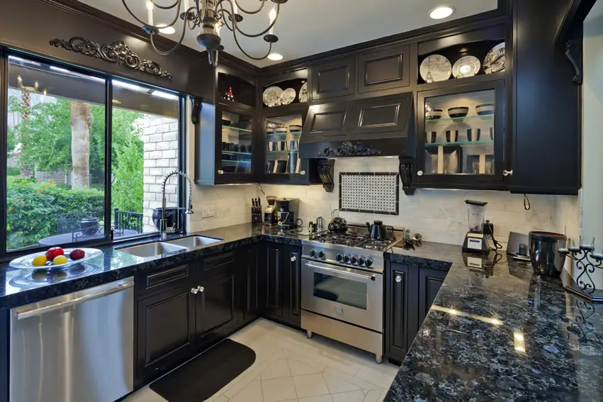 Small luxury kitchen with black cabinets and granite design