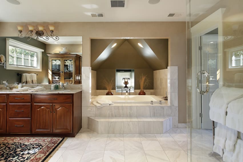 Spacious bathroom uses high quality marble floor tiles