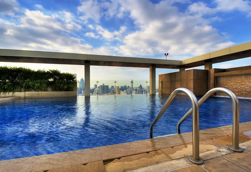 Pool on top of a high rise building with steel railing