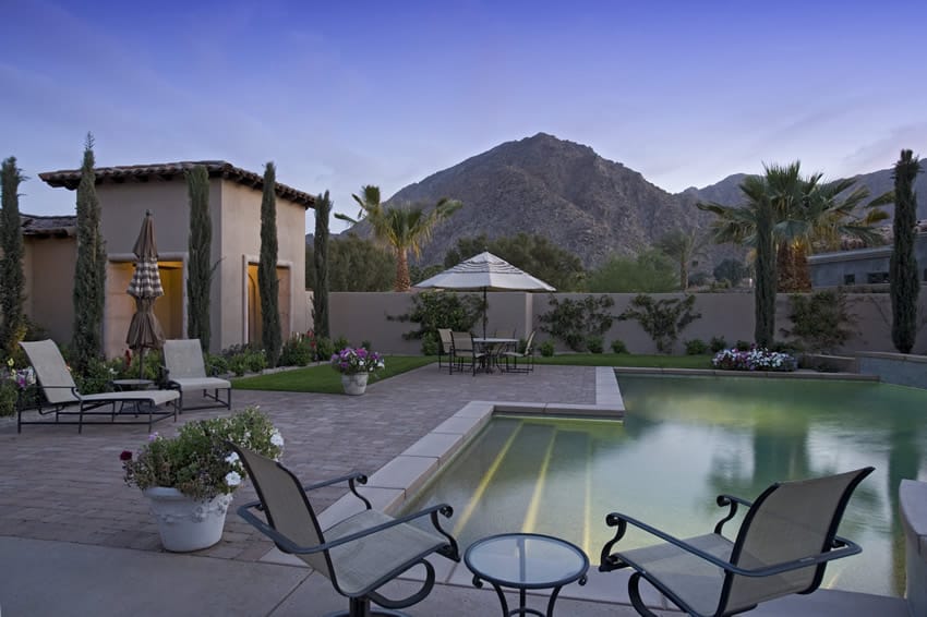 Swimming pool overlooking mountains and palm trees