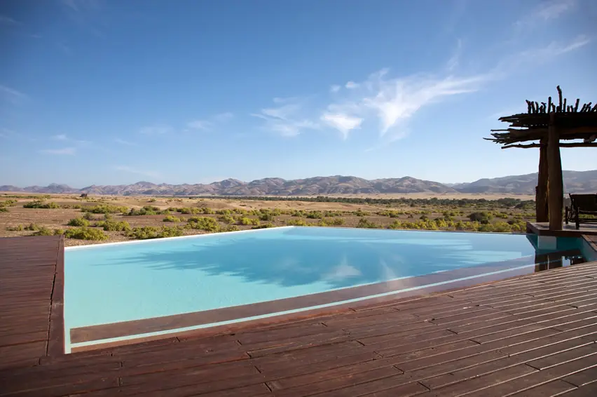 Pool with teakwood decking and cabana