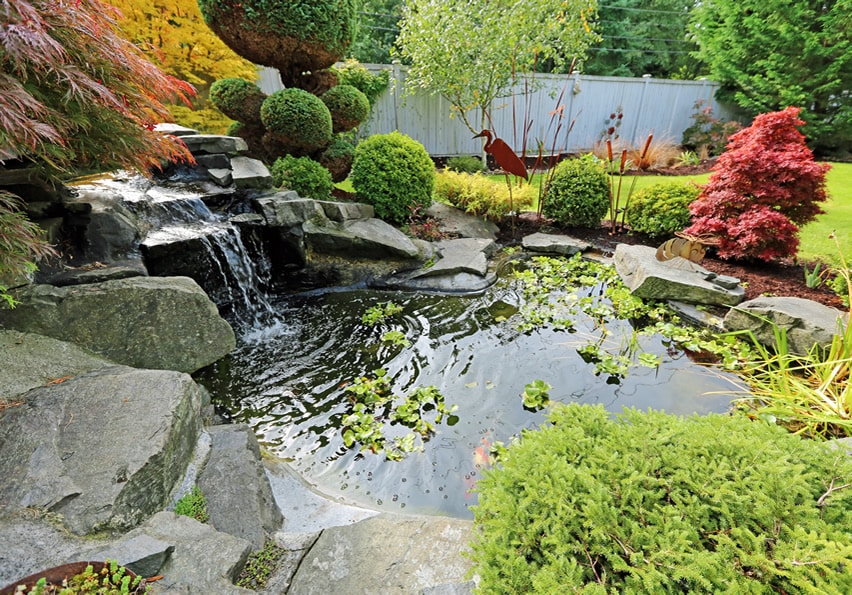 Tropical waterfall in home backyard