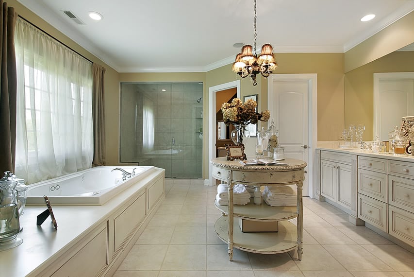 Elegant bathroom uses 30x30 marble finish ceramic tiles and features island vanity