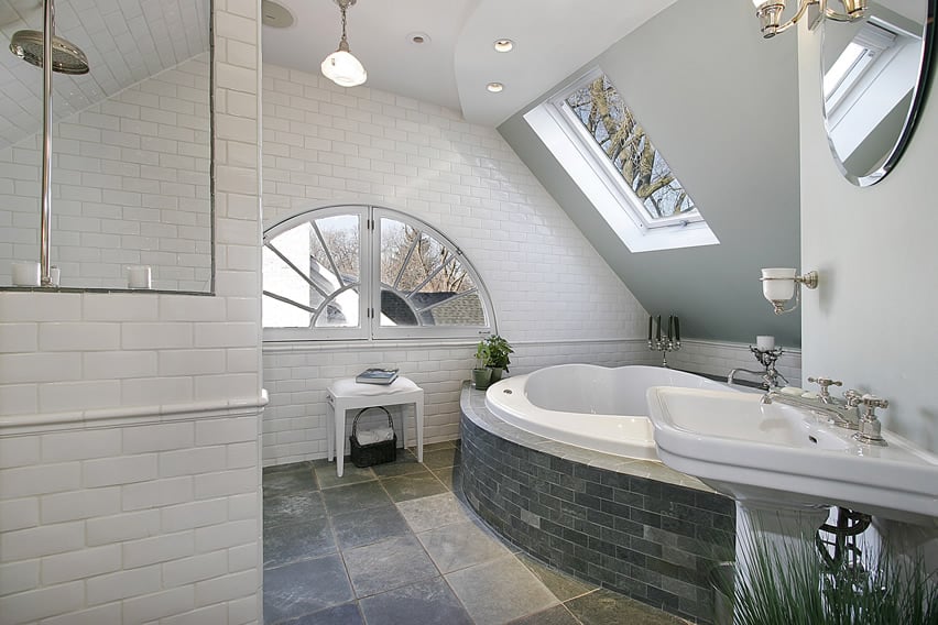 Simple bathroom design uses 30x60 slate tiles for its floors, in combination with brick-sized slate tiles