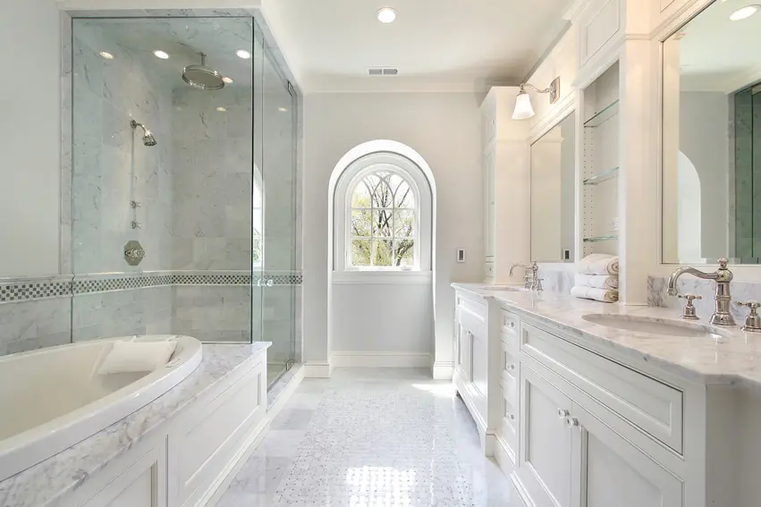 Elegant bathroom is a mixture of classic features and modern with a walk-in-shower