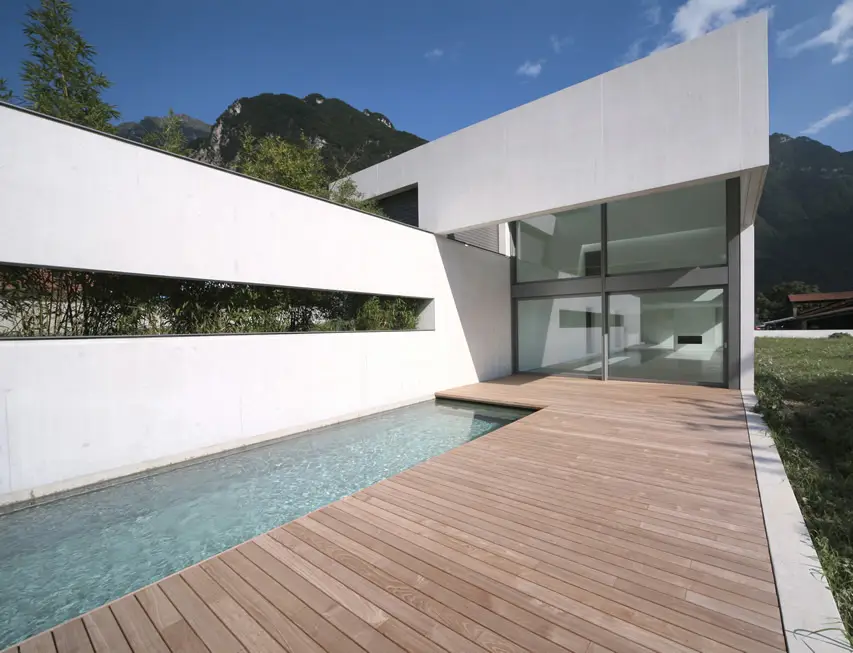 Pool with narrow deck and white wall
