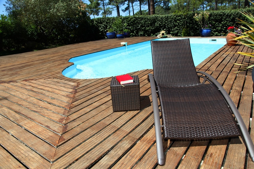 Wood deck surrounding pool