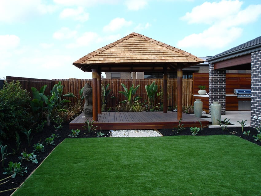 wooden backyard deck with gazebo