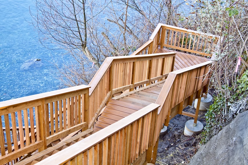 Wooden deck stairs down to lake