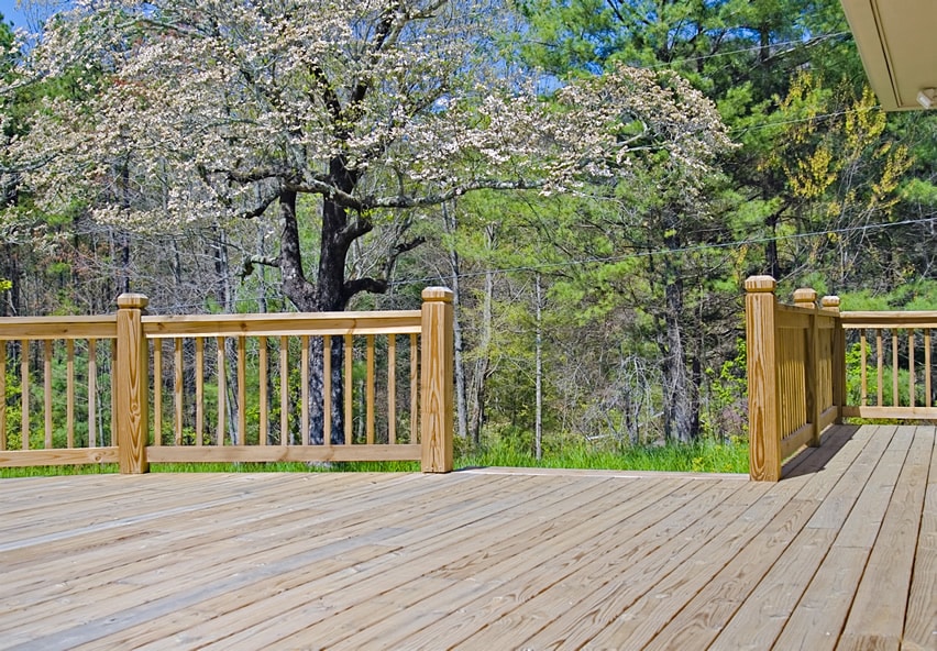 Wooden deck with wood hand rails