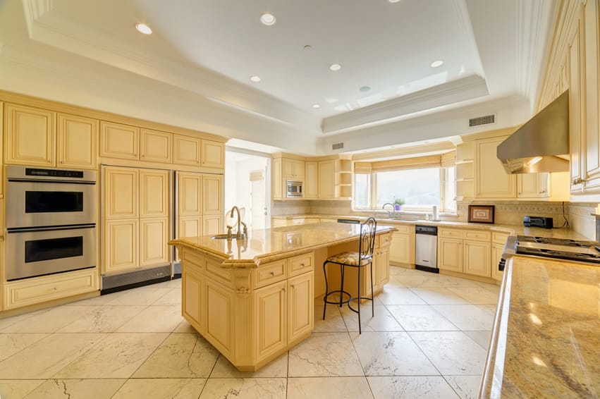 Bright large kitchen design with tray ceiling