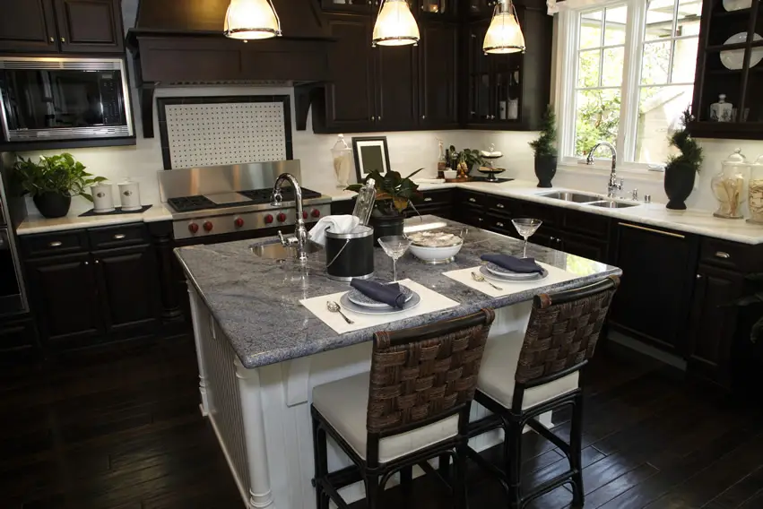 Dark cabinet and floor kitchen with dining island