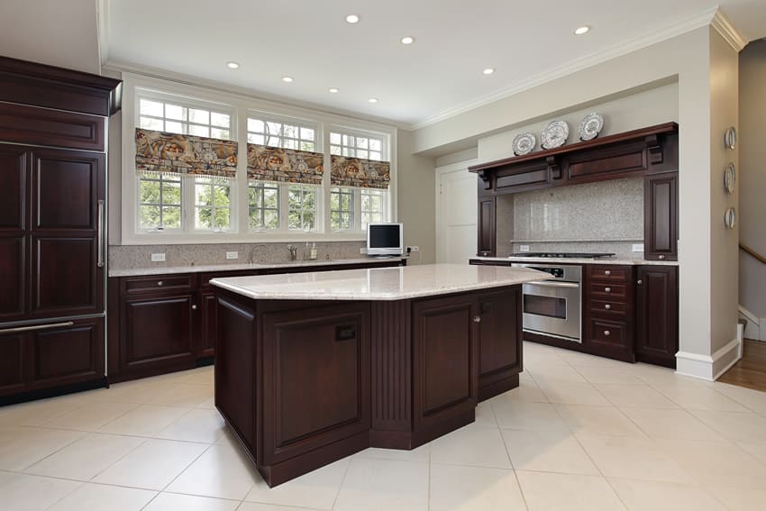 Dark cabinet kitchen with light flooring tiles