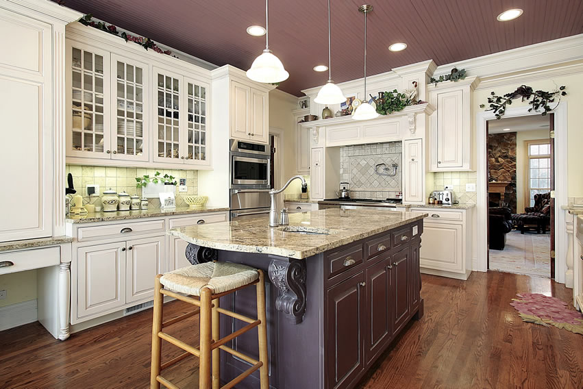 Kitchen with grayish purple ceiling pain, white stool and plant decor on walls