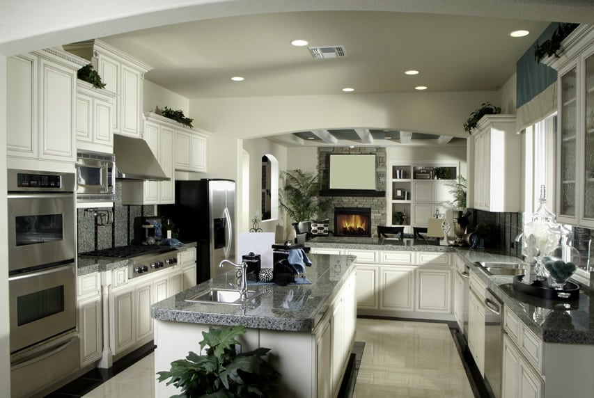 Kitchen with thick cut granite and a white theme
