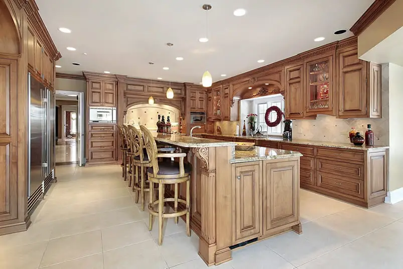 Chefs kitchen with pendant lighting and two level breakfast bar