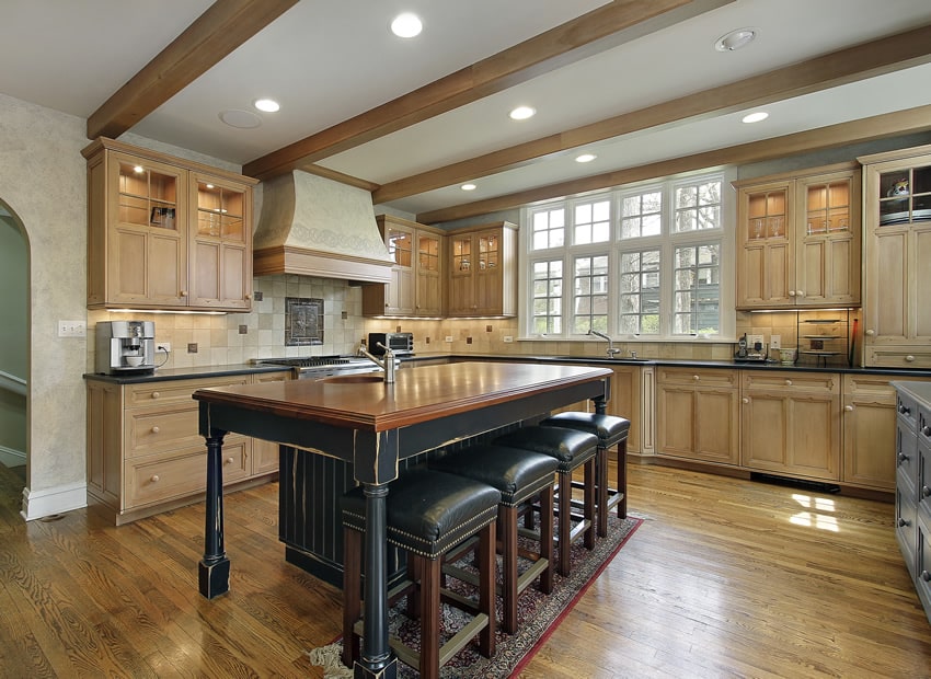Oak kitchen in luxury home with distressed wood island