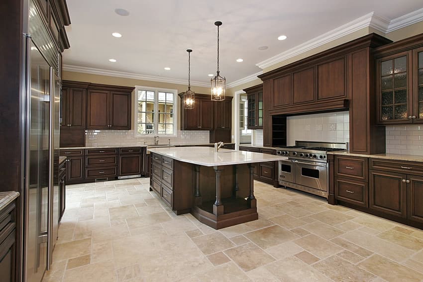 Spacious kitchen in luxury home with dark wood cabinets