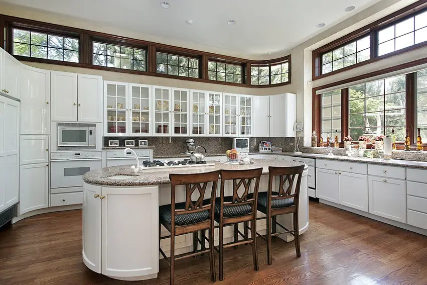 White brown theme luxury kitchen with oval island