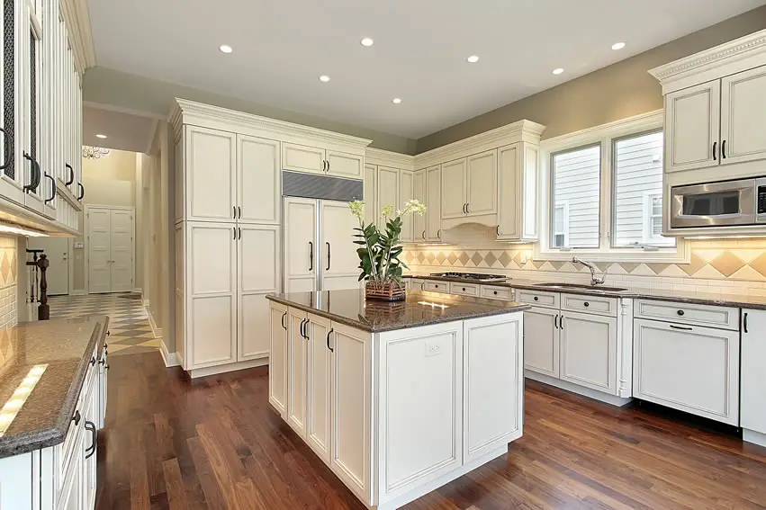 White cabinet kitchen with tile backsplash