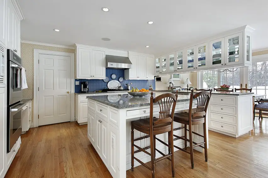 White classic kitchen design with glass faced cabinets