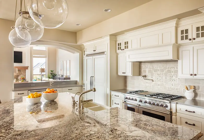 White luxury kitchen with light beige granite counter tops