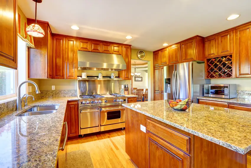 Wood luxury kitchen with light granite counters